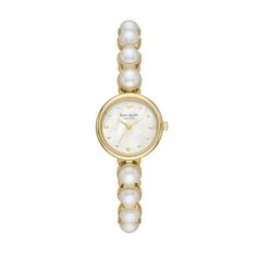 From the Kate Spade Monroe Collection, this ladies' watch features a mother-of-pearl dial with gold-toned hands and markers and mineral crystal in a 24.0mm gold-toned stainless steel case. The reliable Japanese quartz movement ensures accurate time keeping. The synthetic pearl and gold-toned stainless steel bracelet secures with a fold-over clasp. Water resistant to 30 meters, this watch comes with a two-year limited manufacturer's warranty. We are an authorized Kate Spade dealer. Kate Spade Watch, Faux Pearl Bracelet, Body Chains, Dope Jewelry, Classy Jewelry, Jewelry Lookbook, Women's Watch, Girly Jewelry, Jewelry Inspo