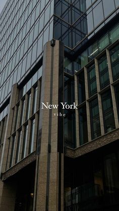 a tall building with windows and the words new york on it