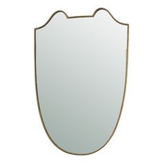 a mirror that is shaped like a shield