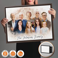 a woman holding up a poster with an image of the family on it in front of her