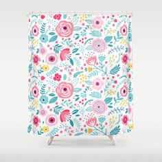 a shower curtain with colorful flowers and leaves on the outside, against a white background