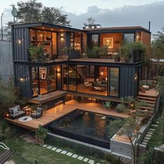 a large house made out of shipping containers