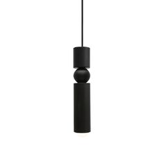 a black pendant light hanging from a ceiling