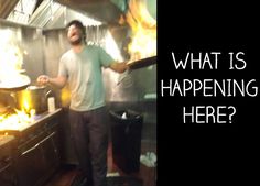 a man standing in a kitchen with flames coming out of the stove and cooking food