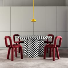 a dining room table with chairs and a black and white table cloth