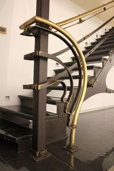 a set of stairs with metal handrails in a building