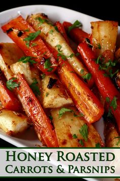 roasted carrots and parsley on a plate with the words honey roasted carrots and parsley