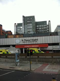 an ambulance station with emergency vehicles parked in front