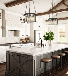 a large kitchen island with stools in it