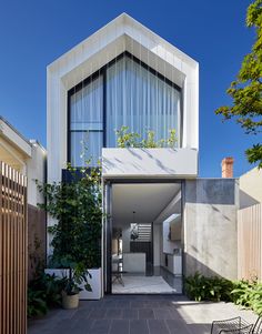 the entrance to this modern house is very narrow