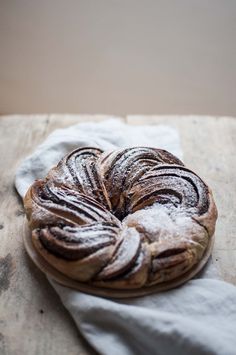 a loaf of bread sitting on top of a white cloth