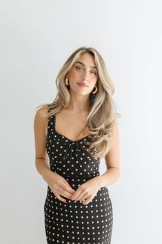 The Ellen Midi Dress is perfect for a fun and flirty date night look! This cute and playful dress features a classic black polka dot print, a flattering bustier sweetheart neckline, and a convenient back zipper closure. Perfect for a fun and flirty date night look! Details + Fit 100% Polyester Runs True to Size Machine Wash Cold Hang Dry Sweetheart Neckline Bustier Chest Sleeveless Back Zipper Closure Polka Dot Print Design Black | White | Printed Model is 5'8" and wearing a size Small