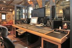 a recording studio with many electronic equipment