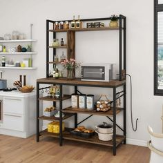 a kitchen with an open shelving unit and wooden floors