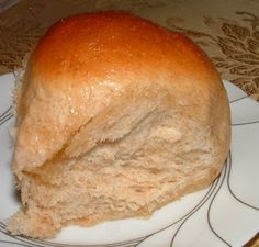 a loaf of bread sitting on top of a white plate