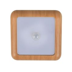 a wooden square light with a white glass in the center on an isolated background photo