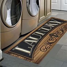 a door mat that says laundry on it next to washer and dryer