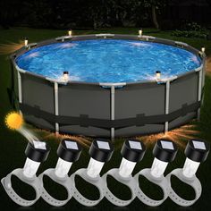 an above ground swimming pool with five lights on each side and four water hoses connected to it