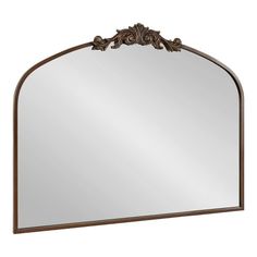 a large mirror with an ornate frame on the top and bottom part, in bronze