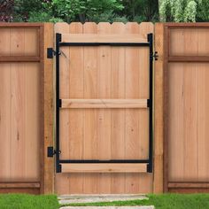 a wooden fence with black iron gate