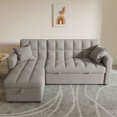 a living room with a large gray sectional couch