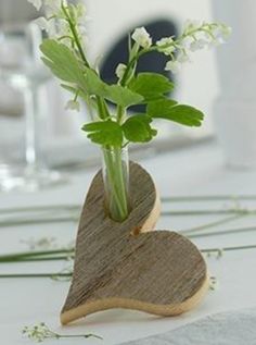 a vase filled with flowers on top of a table