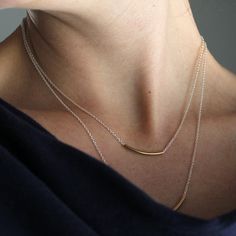 Two free-sliding brightly polished arc tubes on a delicate chain. The tubes hang together in the center forming a gentle point or arrow shape. This piece has great movement creating almost a liquid appearance. A simple, yet striking piece, great for layering. Comes in 16 and 18 inch lengths with sterling silver, 14k gold fill, or mixed metal options. All Rebecca Haas Jewelry is handcrafted by me in my Southern Vermont Studio from recycled and ethically sourced materials. Tube Necklace, Simple Chain, Everyday Necklace, Delicate Chain, Modern Necklaces, Simple Necklace, Layered Necklaces, Gift Necklace, Sterling Silver Chains