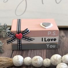 a gift box sitting on top of a wooden table next to other items and decorations