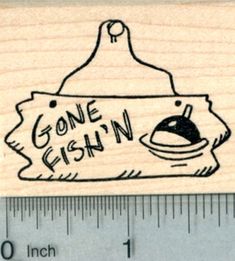 a rubber stamp with the words gone fishin on it and an image of a frying pan