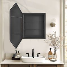 a bathroom vanity with two sinks and an open door on the wall next to it