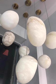 some white and gold balls hanging from the ceiling