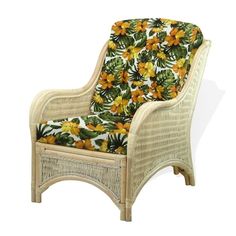 a wicker chair with yellow and green flowers on the seat cushion is upholstered