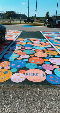 the parking lot has been painted with colorful circles