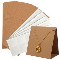 PRICES MAY VARY. HIGH QUALITY - Our Earring Display Cards are made of high quality paper material with pre-cut holes and pre-scored which are very easy to use. SIZE - Each standing earring card measures 8.5 x 5 x 8.5 cm/3.4 x 2 x 3.4 Inch. UNIQUE DESIGN - These display cards are the perfect gift for anyone who needs to display their earrings and necklace vertically. They stand securely on the table without the use of a display stand. EASY TO OPERATE - Each earring card is pre-scored so it's easy Packaging For Small Business, Earring Packaging, Small Business Jewelry, Necklace Pouch, Earring Display Cards, Business Jewelry, Jewelry Cards, Jewelry Display Cards, Sell Diy