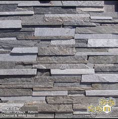 a stone wall that is made out of different types of stones