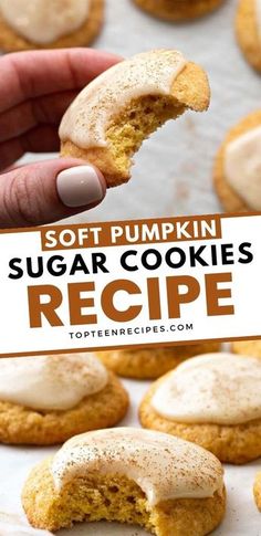 soft pumpkin sugar cookies with white frosting being held up by a person's hand