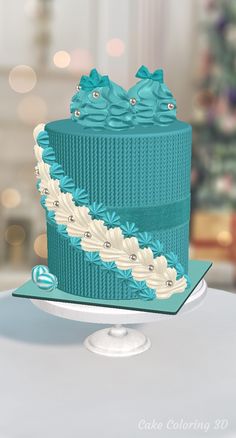 two tiered cake with blue frosting and bows on top