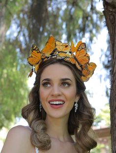 From our Whimsical Collection, this elegant women's headpiece features butterflies perched on a comfortable satin headband base with butterflies. Pictured are orange monarch butterflies; you have the option to pick others butterfly colors as well. I N C L U D E D Satin headband base topped with high quality intricately detailed feather butterflies. S H I P P I N G - Processed same day or within 24 hours. 1-2 day guaranteed delivery, add item to cart, click shipping tab for rates. Pls leave a che Monarch Butterfly Costume, Orange Monarch Butterfly, Butterfly Colors, Butterfly Headpiece, Masquerade Mask Women, Butterfly Wedding Theme, Masquerade Ball Masks, Butterfly Headband, Butterfly Crown