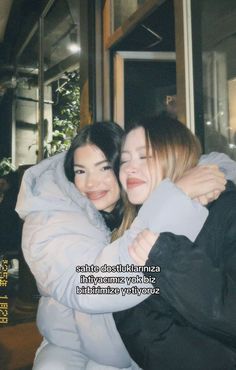 two women hugging each other in front of a building with the caption that says,