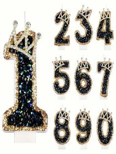 the number one is made out of sequins and has been decorated with crown jewels