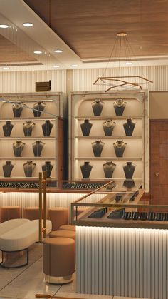 the interior of a jewelry store with rows of necklaces on display in glass cases