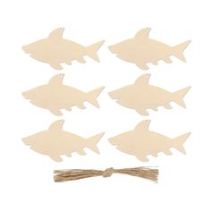 wooden cutouts of fish on a string with some other pieces in the shape of sharks