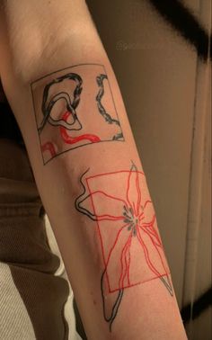 a person with a tattoo on their arm that has different images and lines in it