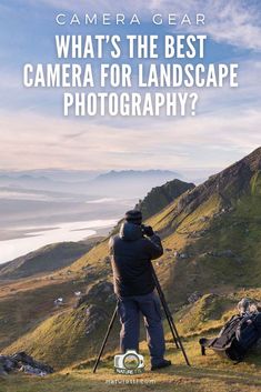 a man standing on top of a lush green hillside next to a mountain with the words camera gear what's the best camera for landscape photography?