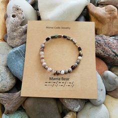 This Beautiful Bracelet Spells Out "Mama Bear" In Morse Code Through A Sequence Of Dots And Dashes. Handmade In My Michigan Studio, This Bracelet Is One Of A Kind, Crafted With Polished Fire Agates And Hematite. Add A Drop Of Your Favorite Essential Oil For An Aromatherapy Bracelet. Perfect For Mother's Day. Tags Yoga Jewelry, Aromatherapy, Agates, Handmade, Artisan Jewelry, Boho, Minimalist, Earth Tones, Metallic Aromatherapy Bracelet, Morse Code Bracelet, Boho Minimalist, Fire Agate, Morse Code, Yoga Jewelry, Jewelry Boho, Mama Bear, Handmade Artisan