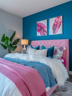 a bedroom with blue walls, pink bedding and white fur on the headboard