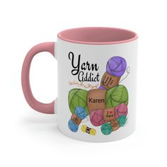 a pink and white coffee mug with yarns on it that says yarnaddict