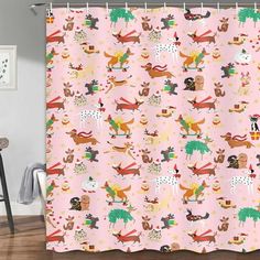 a pink shower curtain with dogs and trees on it