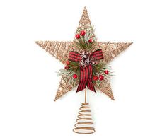 a christmas tree topper with a red bow on it and a star shaped decoration