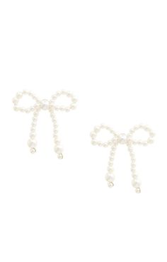 two bows with pearls on them are attached to the back of each earring,